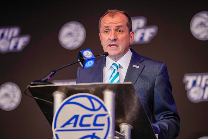 ACC commish Jim Phillips talks to reporters.